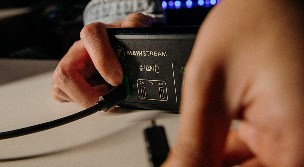 Photo of hand pluging in a cable into the DLZ Creator XS